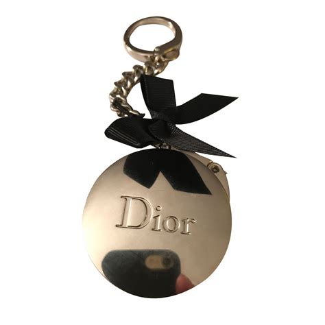 dior pin shirt|Dior bag charm.